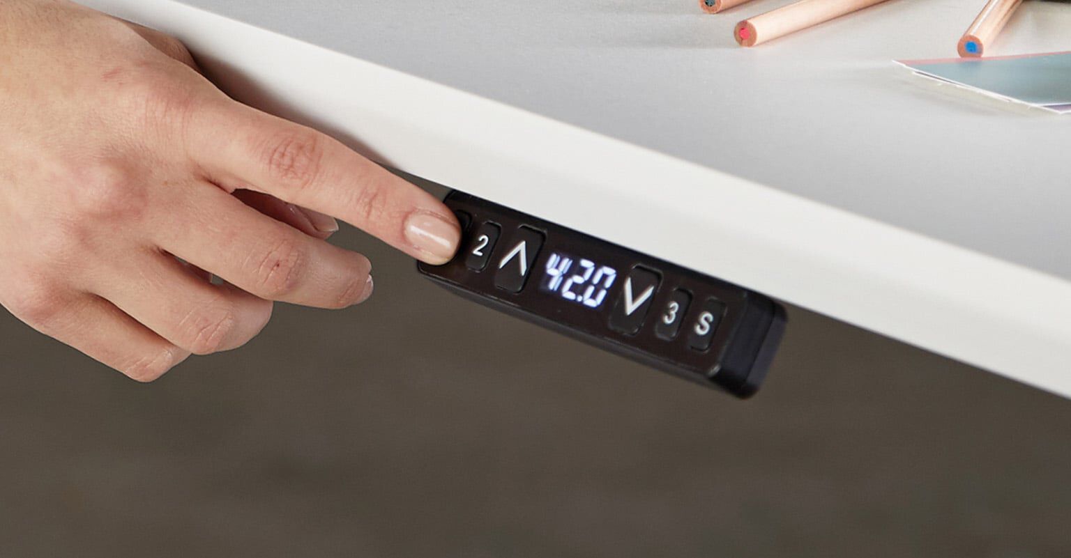memory presets being used on a control panel of a vari electric standing desk